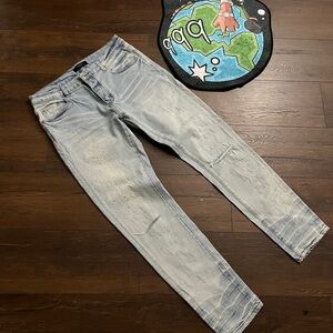 Amiri Light Wash Distressed Skinny Jeans